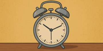 Person daydreaming at a desk, illustrating the benefits of boredom for creativity and well-being