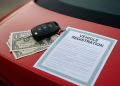 Car registration document and keys on a desk illustrating fast vehicle registration loans